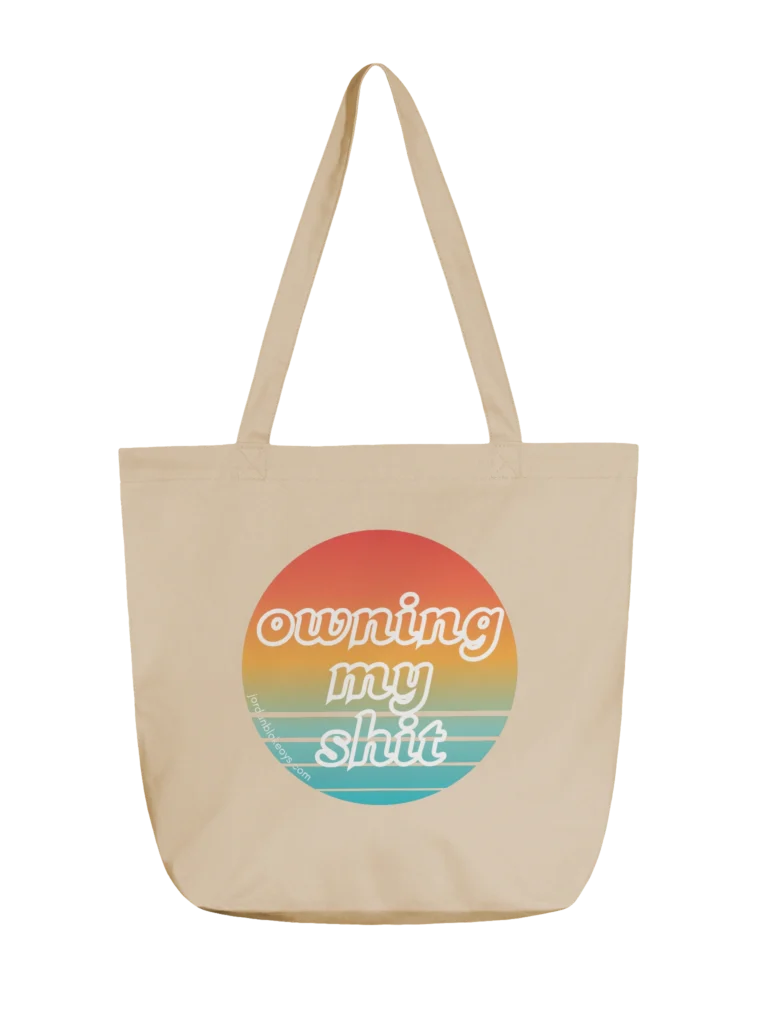 Owning my shit tote beige canvas tote bag with owning my shit multi colored design by author Jordan Blake
